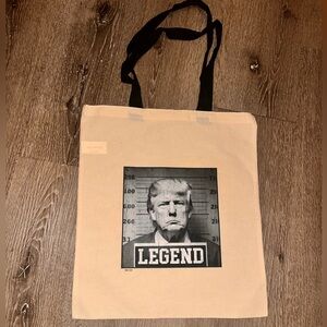 Donald trump unisex off-white/cream tote bag black handles 17in long 15in wide